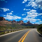 a road with a mountain in the background