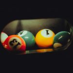 a pool table with pool balls in it